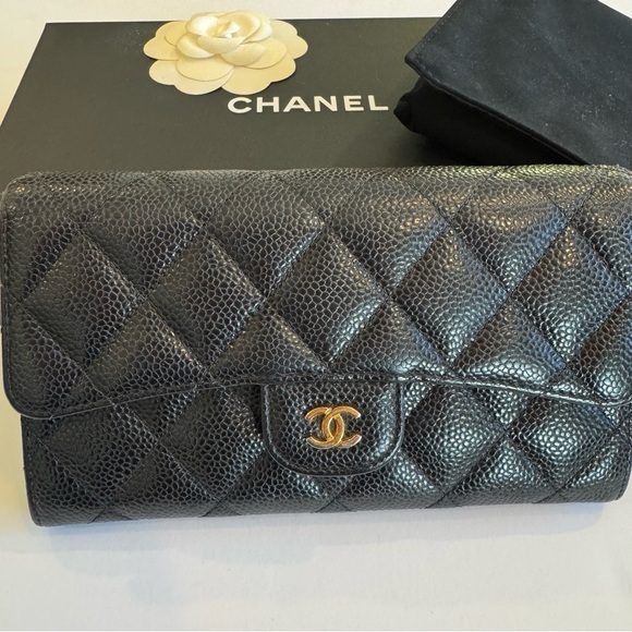 CHANEL Handbags - CHANEL Black Quilted Leather Clutch with Gold Logo